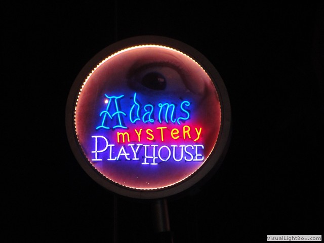 Adams Mystery Playhouse neon sign - blue and pink neon lettering